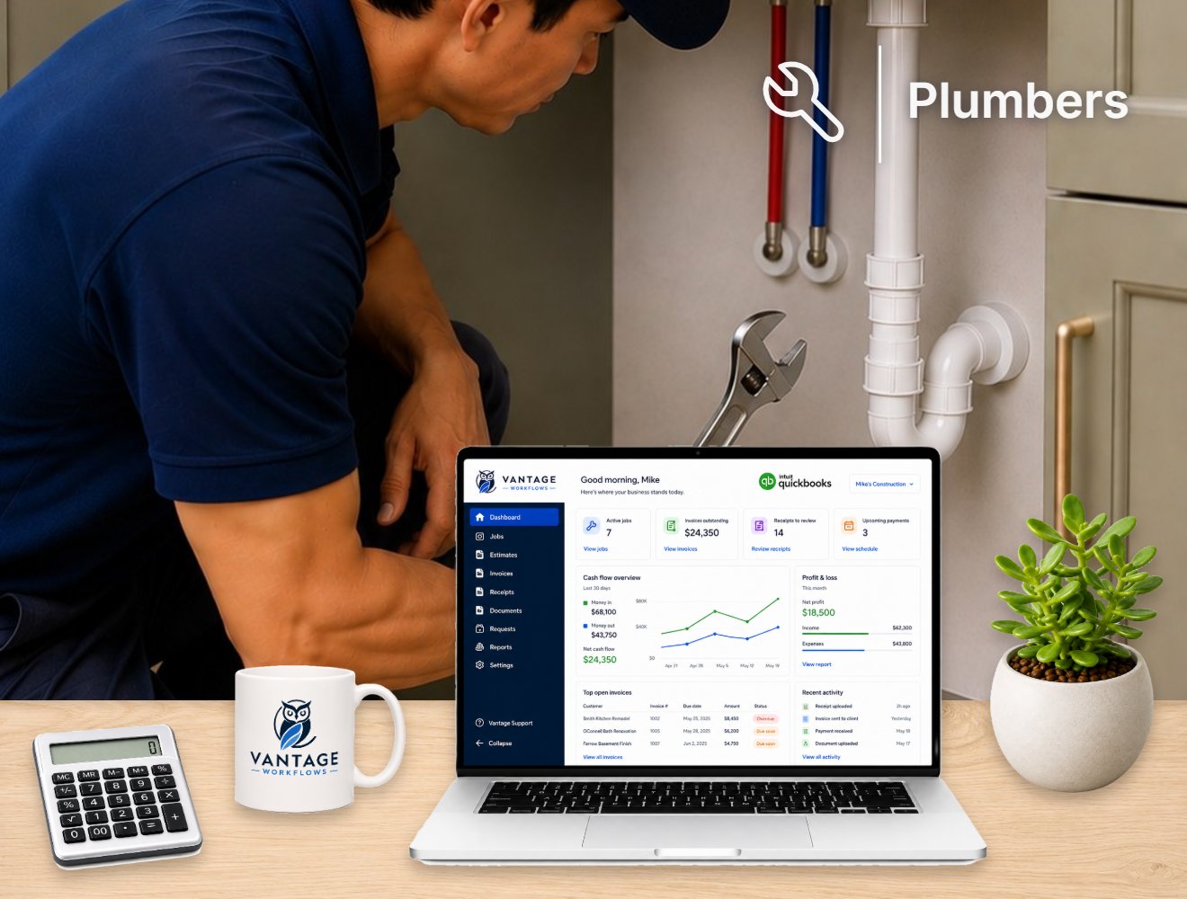 The Vantage dashboard on a contractor's desk, a plumber working under a kitchen sink behind it